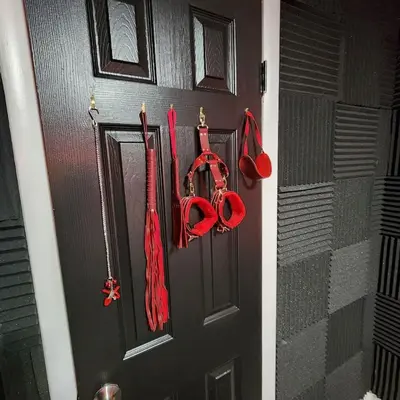 a door with red umbrellas hanging on it at 6Br 2bth NYC Penn Station NYC USA Mall EWR in Newark