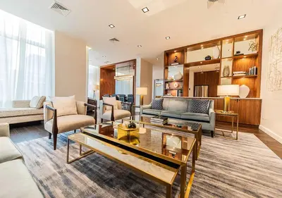 a living room with a couch and a table at Entire luxury apt midtown with pool, gym, and sauna in New York