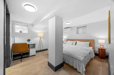 a bedroom with a bed and a desk and a chair at luxury 2 bed 2 bath apt with free parking in Jersey City