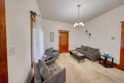 a living room with two couches and a table at Charming 2-Bedroom, 1-Bath Getaway in Carbondale