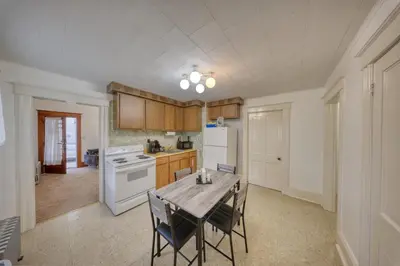 a kitchen with a table and chairs in a room at Charming 2-Bedroom, 1-Bath Getaway in Carbondale