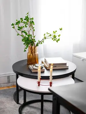a table with two candles and books on it at Spacious 3BR Retreat Near Times Square in New York