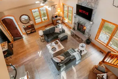 an overhead view of a living room with a fireplace at Tuthill Treehouse - Secluded Mountain Cabin with Roof Deck & Fire Pit in Pond Eddy
