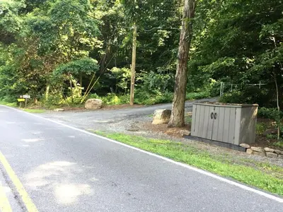 an empty road with a box on the side of the road at Fantastic A-Frame Cabin for a Couples' Getaway near Robesonia, Pennsylvania in Robesonia