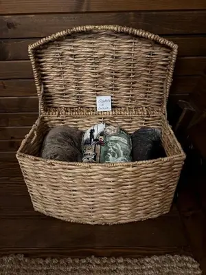 a wicker basket sitting on the floor at Elegant, Vintage Conestoga Covered Wagon Getaway in Denver, Pennsylvania in Denver