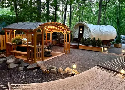 a backyard with a yurt and a tent at Elegant, Vintage Conestoga Covered Wagon Getaway in Denver, Pennsylvania in Denver