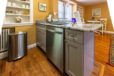 a kitchen with a sink and a counter top at Comfy 1 BR Hide Away Apt w Garage Parking in Bryn Mawr