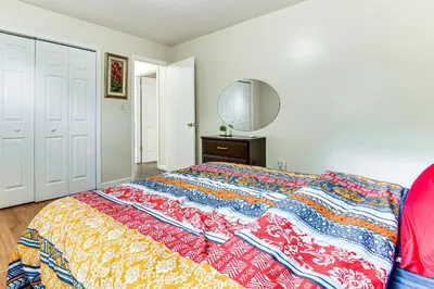 a bedroom with a bed with a colorful blanket at 2 Mi to The Marketplace Spring Valley Apartment in Spring Valley