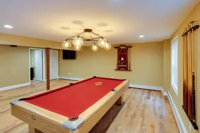 a living room with a pool table in it at Creek Dips and Smores Catskills Gem