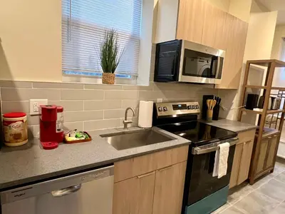 a kitchen with a sink and a stove at Skylight studio Rittenhouse philadelphia in Philadelphia