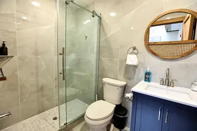 a bathroom with a shower and a toilet and a sink at Skylight studio Rittenhouse philadelphia in Philadelphia