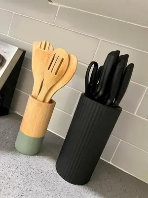 two black cups with utensils on a counter at Skylight studio Rittenhouse philadelphia in Philadelphia