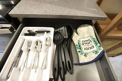 a drawer with knives and utensils in a refrigerator at Skylight studio Rittenhouse philadelphia in Philadelphia