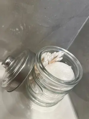 a glass jar of white powder next to a spoon at Skylight studio Rittenhouse philadelphia in Philadelphia