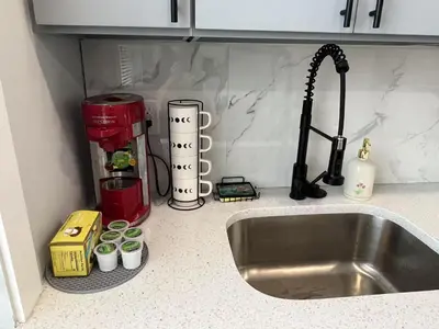 a kitchen counter top with a sink and a counter top at New 1BR Walk to Pats & Genos in Philadelphia