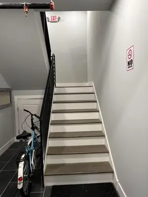 a staircase with a bike parked next to a stair case at New 1BR Walk to Pats & Genos in Philadelphia