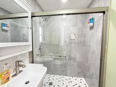 a bathroom with a shower and a sink at New York City Dreams - 10 Mins in Union City