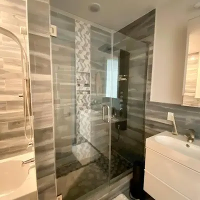 a bathroom with a shower and a sink at Contemporary Luxury 3 Bdr Apt for 6 with Free Parking in Jersey City