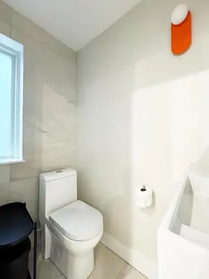 a bathroom with a white toilet and a sink at The Executive - Center-City - 3BR-4Bath-Private-Garage in Philadelphia