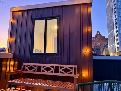 a wooden building with a bench on a balcony at The Executive - Center-City - 3BR-4Bath-Private-Garage in Philadelphia
