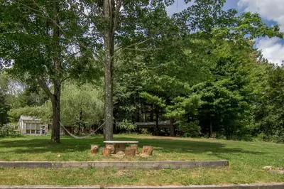 a park with a picnic table and trees at Cozy Cottage on a Private Farm Nestled Among the Southern Catskill Mountains in Woodridge, New York in Woodridge