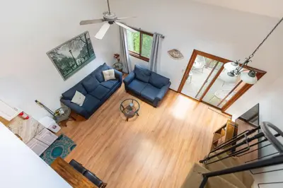 an overhead view of a living room with blue furniture at Cozy Loft Near Lake Trails and Mountain Views in Vernon Township