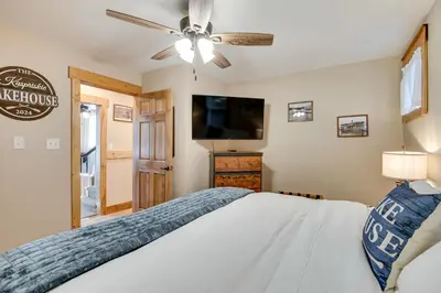 a bedroom with a bed and a ceiling fan at Recently Renovated Harveys Lake Retreat with Dock! in Harveys Lake
