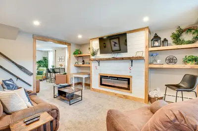 a living room with a couch and a fireplace at Recently Renovated Harveys Lake Retreat with Dock! in Harveys Lake