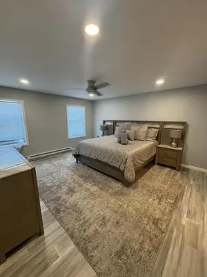 a bedroom with a bed and a ceiling fan at Escape to Luxury in the Poconos Your Year-Round Family Retreat in Daleville