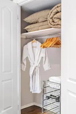 a closet with a white robe on a shelf at Studio Nolita in New York