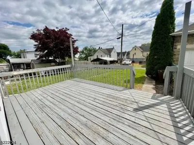 a wooden deck with a fence on a house at Little France Alsace in Phillipsburg