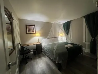 a bedroom with a bed with a canopy at Little France Alsace in Phillipsburg