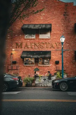 a brick building with a pharmacy sign on it at Mainstay Inn in Phoenixville