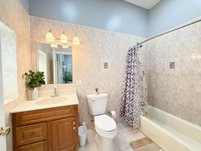 a bathroom with a toilet and a sink and a shower at Huge apartment near NYC, Parking in North Bergen