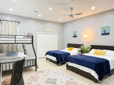 a bedroom with two beds and a bunk bed at Huge apartment near NYC, Parking in North Bergen