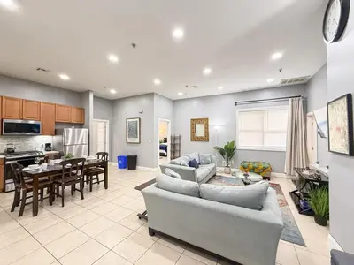 a living room with a couch and a table at Huge apartment near NYC, Parking in North Bergen