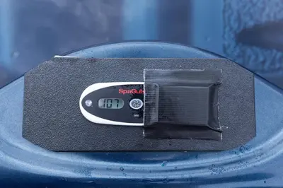 a scale sitting on top of a blue table at Spectacular Buckleberry View EV Recharge Hot Tub Fireplace Jacuzzi in Spring Mills
