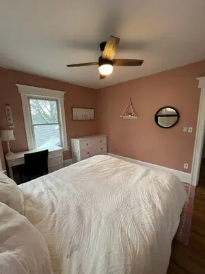 a bedroom with a bed and a ceiling fan at Grand Bergen Home Near NYC-Shops in Maywood