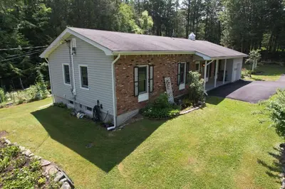 a small house in the middle of a yard at Catskills Getaway 3BR Retreat with Media Room, Near Casino, Bethel Woods and More in Glen Wild