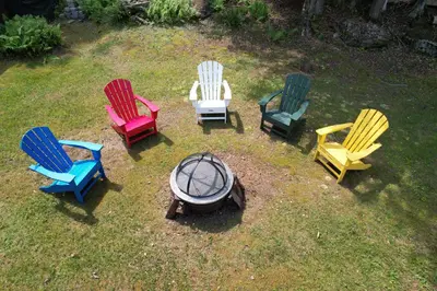 a group of chairs sitting around a fire pit at Catskills Getaway 3BR Retreat with Media Room, Near Casino, Bethel Woods and More in Glen Wild