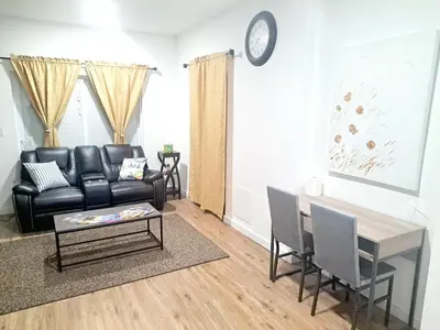 a living room with a couch and a table at Cozy Guesthouse in Catasauqua