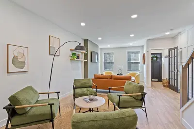 a living room with a couch and chairs at Welcome to The Lux Collective a Spacious 5-Bedroom House close to Stadiums, Universities, Center City & more! in Philadelphia