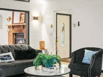 a living room with a couch and a coffee table at Memorabile Getaway Fire-Pit and Entrainment Area in Long Pond