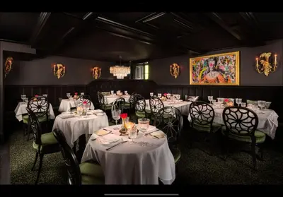 a dining room with tables and chairs with white table cloth at Carversville Inn in New Hope