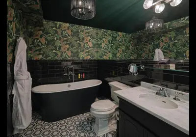 a bathroom with a tub and a toilet and a sink at Carversville Inn in New Hope