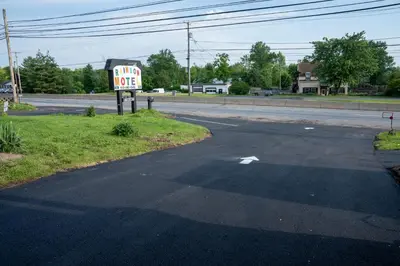 an empty street with a stop sign on the side of the road at Rainbow Motel in Douglassville