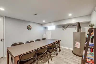 a conference room with a table and chairs at Group Getaway with Games and Patio in Philadelphia! in Philadelphia