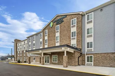 a rendering of a hotel with a building at WoodSpring Suites Wilmington Riverfront in Wilmington