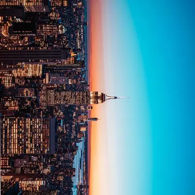 an airplane flying over a city at night at Quiet close to NYC BBQ Deck in Jersey City