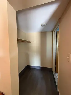 an empty room with a ceiling and a closet at Linden Motor Inn in Linden